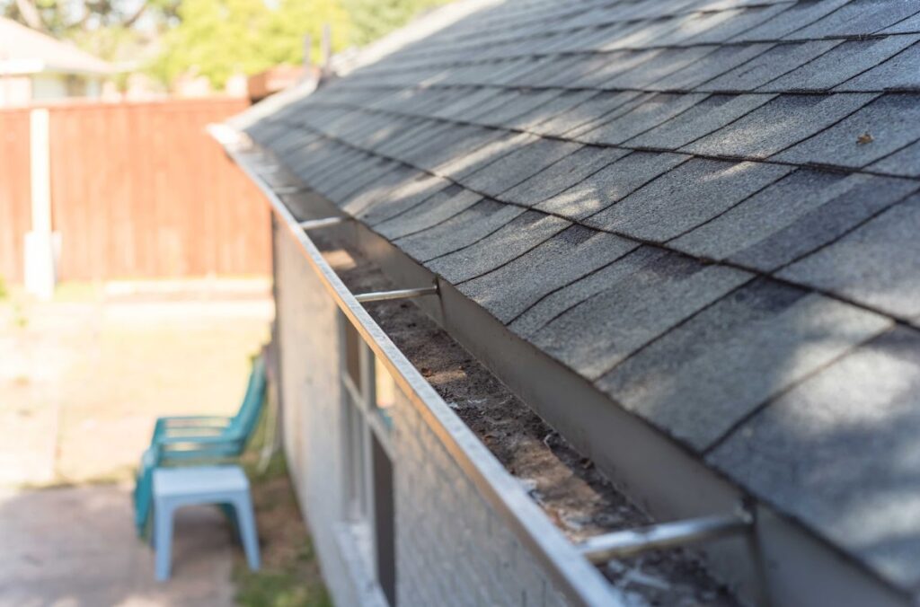 clean gutters to prevent ice dams on roof