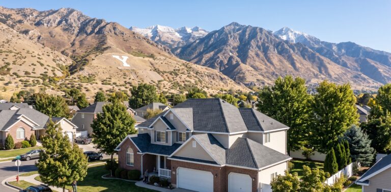 New asphalt shingle roof on a Provo, Utah home with Y Mountain and the Wasatch Range behind it